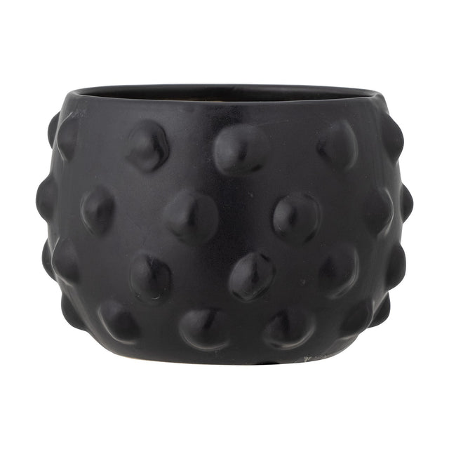 Parvin Terracotta Plant Pot in black, round wide-bodied design with raised dot texture covering the surface, shown on a plain white background.