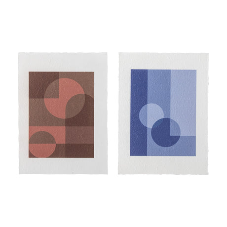 Bogi Posters Set of 2 in Multi, two portrait prints with overlapping circles and stepped blocks in terracotta and blue tones on wide white borders, shown against a plain background.