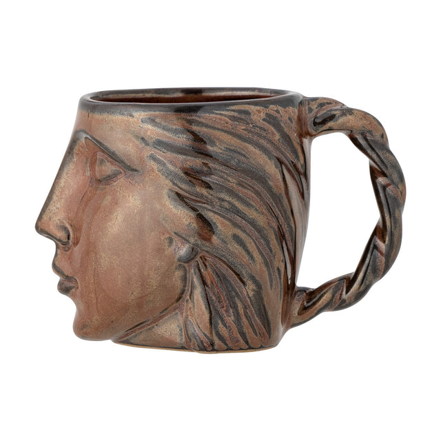 Reeha Stoneware Mug 310ml in brown, sculpted as a face with closed eyes and swept-back hair forming a twisted plait handle, shown on a plain white background.