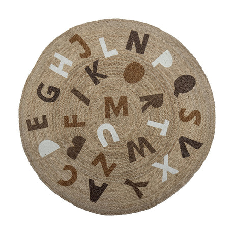Dinne Round Jute Rug 130cm in beige, printed with scattered capital letters in brown, white and tan tones, shown on a plain white background.