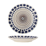 Shama Dotted Stoneware Dinner Plate in white with a hand-painted navy dot border and a spiralling blue-brown centre line, shown front-facing and in profile on a white background.