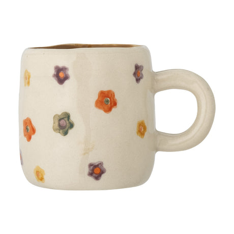 Addy Stoneware Cup 130ml in cream, a small ceramic kids' cup with a rounded body, loop handle, and hand-painted multicoloured flowers, shown on a plain white background.
