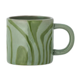 Ninka Stoneware Cup 200ml in green with bold, flowing darker green stripes and a rounded loop handle, shown on a plain white background.