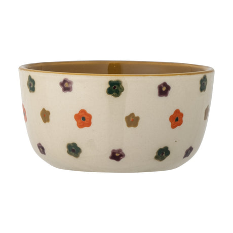 Addy Stoneware Bowl 12cm in cream, with a brown interior glaze and hand-painted flower dots in red, green, purple and mustard around the exterior, shown on a plain white background.