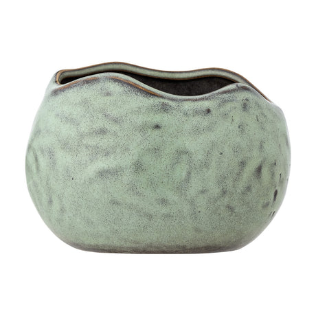 Pennie Stoneware Plant Pot in green, a rounded ceramic planter with a dimpled surface, wavy uneven rim, and speckled glaze, shown on a plain white background.