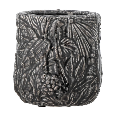 Nikou Terracotta Plant Pot in black, round shape with raised botanical leaf and fruit relief covering the glossy surface, shown on a plain white background.