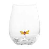 Misa Butterfly Tumbler in clear glass, stemless with a rounded bowl and thick base, featuring a small yellow and red glass butterfly hovering on a stalk inside, shown on a white background.