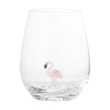 Misa Flamingo Tumbler in clear mouthblown glass with a rounded, stemless body and a small pink glass flamingo standing on a stem at the base, shown against a plain white background.