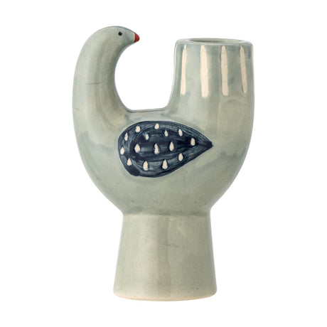Trudy Bird Stoneware Candle Holder in green, shaped like a perched bird with a curved neck, red beak, dotted wing design, and a candle cup on its back, set on a plain white background.