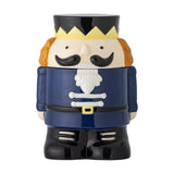Feast Nutcracker Christmas storage jar, 900ml ceramic jar shaped as a soldier with crown, moustache, navy coat and black boots, lid as head and hat, on a white background.