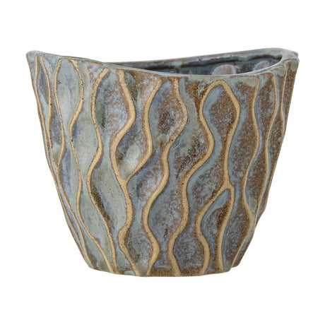 Feren Stoneware Plant Pot in Blue, a small ceramic planter with wavy raised lines and speckled blue glaze over a brown base, tapered body and uneven rim, shown on a plain white background.