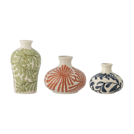 Set of three stoneware vases with hand-painted leaf patterns in green, orange, and navy on cream glaze, varying shouldered and rounded shapes, on a plain white background.