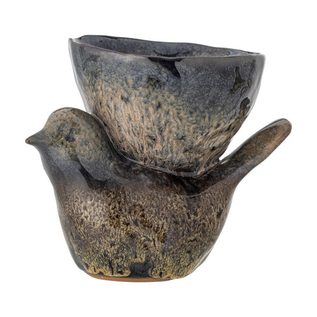 Phil Bird Stoneware Ornament in brown, a ceramic bird figurine with pointed beak and raised tail carrying a wavy-rimmed bowl on its back, speckled glossy glaze, on a plain white background.