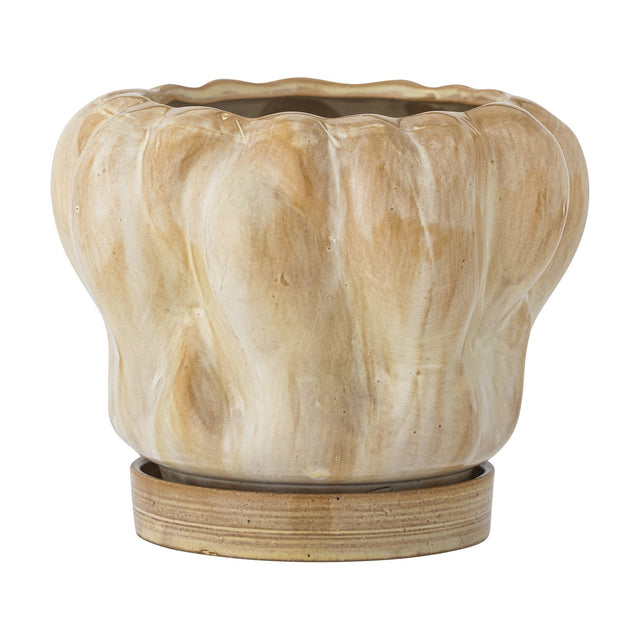 Hollis stoneware plant pot with a wavy, lobed ridged body in glossy beige, shown with its matching saucer on a plain white background.
