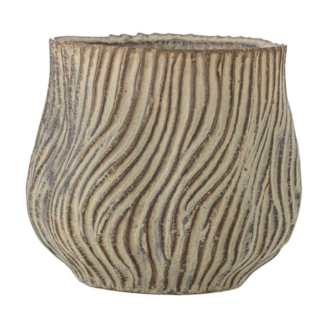 Dua stoneware plant pot in brown, round ceramic body with rippling ridged texture and a rough notched rim, shown on a plain white background.