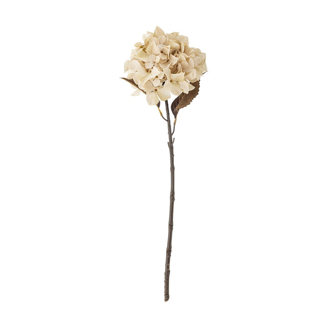Artificial hydrangea stem in beige with a full, rounded mophead bloom, twin leaves beneath, and a knotted woody-look stem, shown against a plain white background.