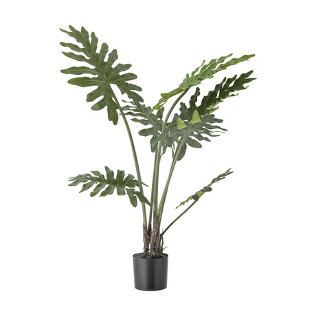 Artificial Philodendron plant with deeply cut split leaves on long green stems, set in a black pot against a plain white background.