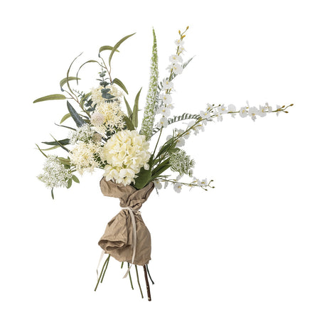 White Symphonie artificial bouquet with a rounded hydrangea-style flowerhead, lacy sprays, arching stems, and green foliage, wrapped in kraft paper tied with ribbon.