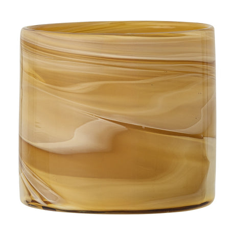 Sylas Glass Tealight Holder in Amber, a round cylindrical glass votive with marbled swirl patterns, shown against a plain white background.