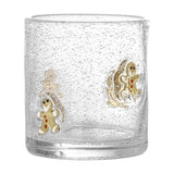 Debra Gingerbread Christmas Tumbler in clear, bubble-textured mouthblown glass with hand-painted gingerbread figures in gold, white and red icing detail, shown on a white background.