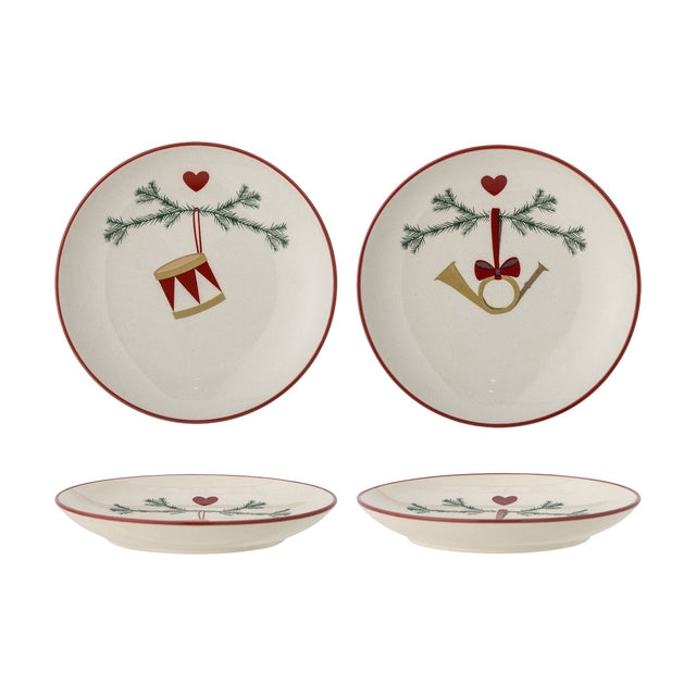 Yule Stoneware Christmas Plates Set of 2 in cream, side plates with red rims featuring pine sprigs, hearts, and drum or horn ornament designs, shown flat and on their sides against a white background.