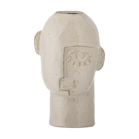 Lizzie Stoneware Vase 25.5cm in beige, shaped like a head with small ears, a raised single-eye face design, and an opening at the crown, set against a plain white background.