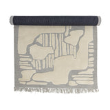 Napoli Wool Rug 200x140cm in grey, partly rolled, showing an abstract raised pattern in ivory with fringed edges on a white background.