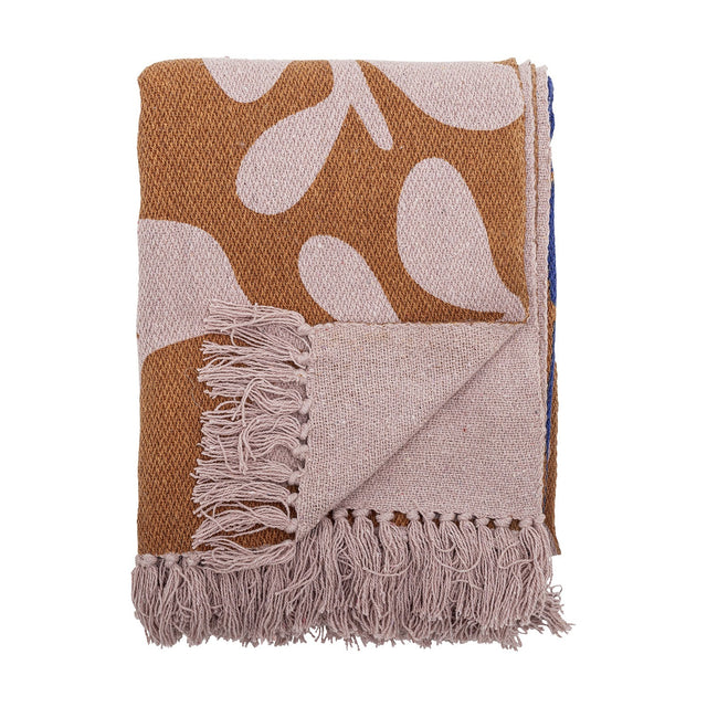 Atle Leaf Cotton Throw in brown, folded cotton throw with a large pale leaf print and knotted fringe edge, shown against a plain white background.