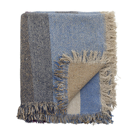 Maji Cotton Throw in Multi, folded cotton-blend throw with blue, charcoal and tan colour-block panels, tweedy flecked texture and loose fringed edges, shown on a plain white background.