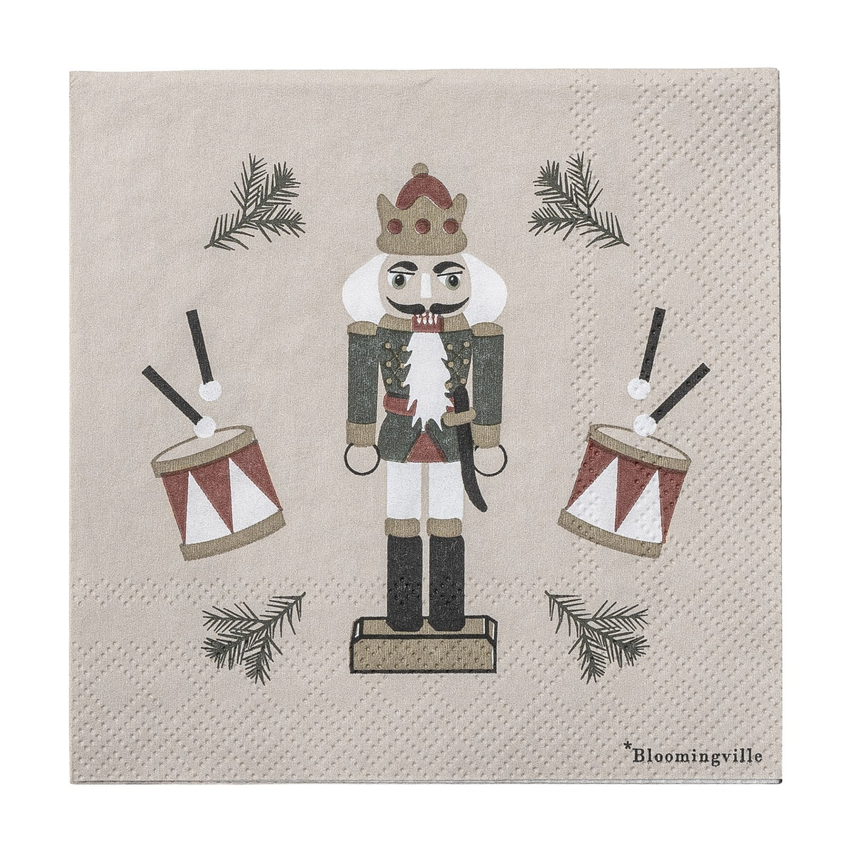 Jolly Paper Christmas Napkin in beige, pack of 20, featuring a crowned nutcracker soldier with drums and pine sprigs on a plain background.