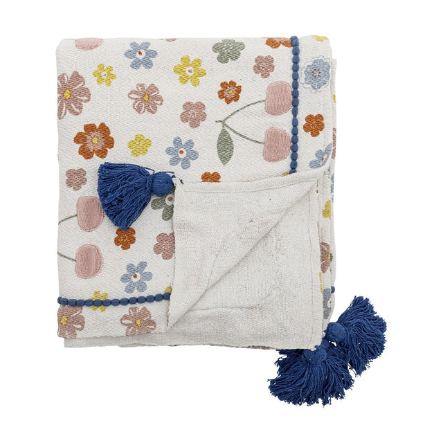 Cherry Floral Cotton Throw in multicoloured folded square, embroidered flowers and cherries with navy pom-pom tassels and contrast trim, on a white background.
