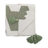 Memmo Cotton Throw in multicoloured cotton, folded to show a bold green letter print on a cream textured ground with matching green tassels, on a white background.