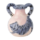 Ryker stoneware candle holder, a small two-handled vase with round pink body and striped blue cat design, arched handles, on a plain white background.