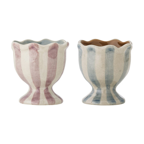 Willa Striped Stoneware Egg Cups Set of 2, footed cups with wavy rims in pink and blue vertical stripes on cream, shown on a white background.