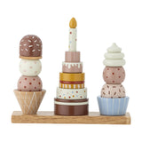 Wooden stacking toy with three dessert towers—ice cream cone, tiered birthday cake, and swirled cupcake—in colourful dotted finishes on a shared base.