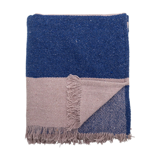 Cadeo Cotton Throw in blue, folded with a contrasting pale taupe band and fringed edges, shown against a plain white background.