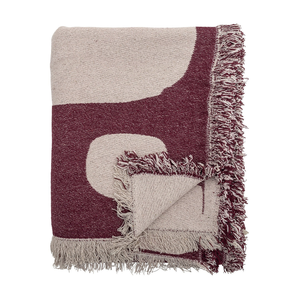 Folded Olica Cotton Throw in red with light beige curved shapes and fringed edges, shown against a plain white background.