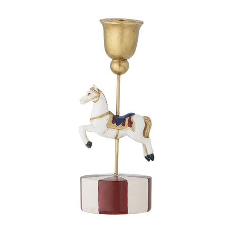 Merry-go-round resin Christmas candle holder with a white carousel horse mid-leap on a slim gold rod, gold bell-shaped cup, and a red-and-white striped round base, on a plain white background.