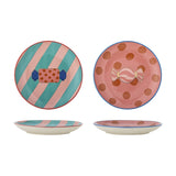 Set of 2 Caramella stoneware Christmas plates with wrapped-sweet design, one teal-pink striped with red rim, the other pink dotted with blue rim, shown front and side.