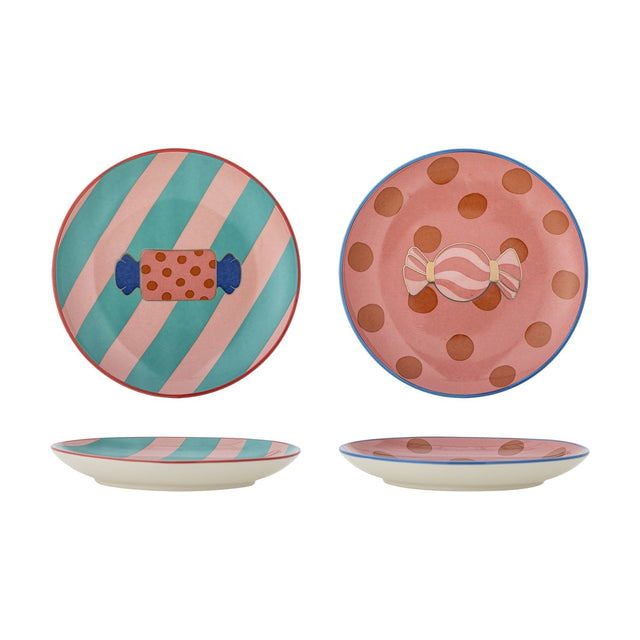Set of 2 Caramella stoneware Christmas plates with wrapped-sweet design, one teal-pink striped with red rim, the other pink dotted with blue rim, shown front and side.