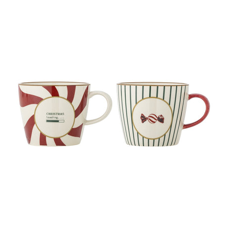 Set of two stoneware Christmas mugs, 380ml, one with a red candy swirl pattern and "Christmas loading" text, the other with green stripes and a sweet motif, on a white background.