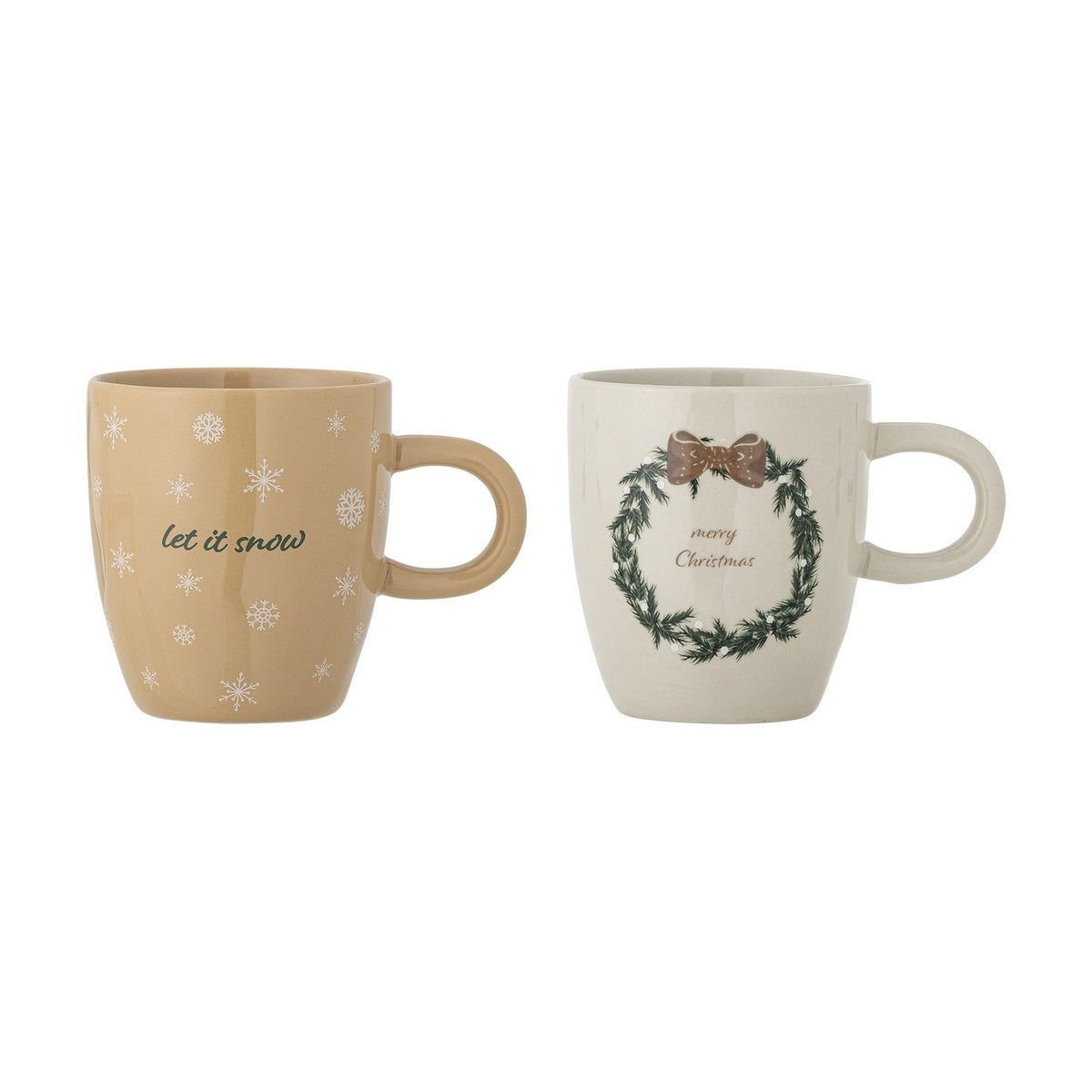 Jolina Christmas stoneware mugs, set of 2, beige with rounded body and loop handle, one with "let it snow" snowflake print, one with wreath and "merry Christmas", on a white background.