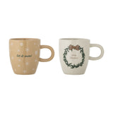 Jolina Christmas stoneware mugs, set of 2, beige with rounded body and loop handle, one with "let it snow" snowflake print, one with wreath and "merry Christmas", on a white background.