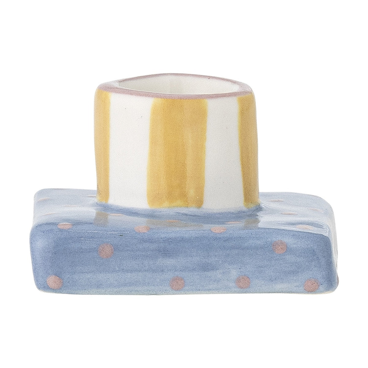 Tacana stoneware candle holder with a round yellow-striped cup on a square blue base with pink polka dots, on a white background.