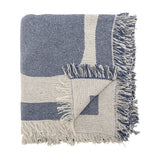 Ethan Cotton Throw in blue, folded to show its bold two-tone graphic pattern and loose fringed edges, cotton-blend fabric, shown on a plain white background.