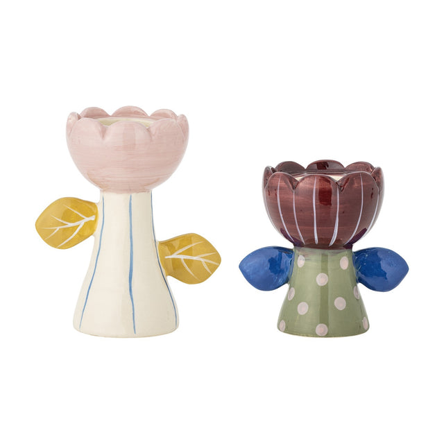 Set of 2 Florita handpainted ceramic flower tealight and candle holders with scalloped petals, leaf handles, and striped and polka dot stems in pink, cream, maroon and green.