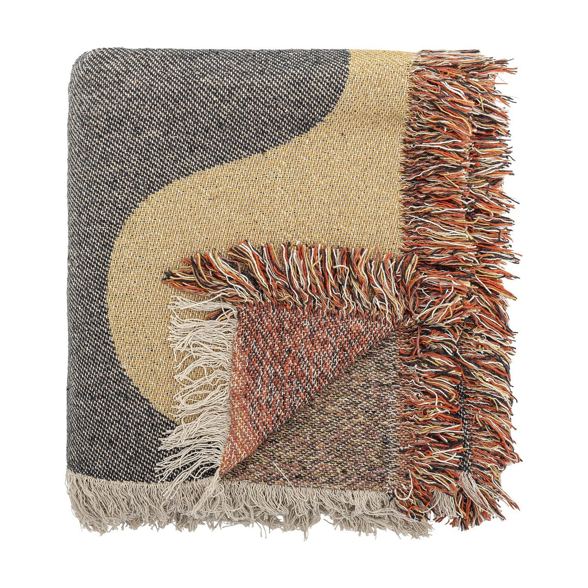 Arni Throw in Multi, a woven throw with a bold black and beige curved colour block design, folded corner revealing a speckled rust-toned reverse, finished with a thick multicoloured fringe.