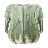 Pontus Stoneware Vase 15.5cm in green, sculpted as a ring of elephant heads with fanned ears and trunk handles curving to the base, scalloped rim, on a plain white background.