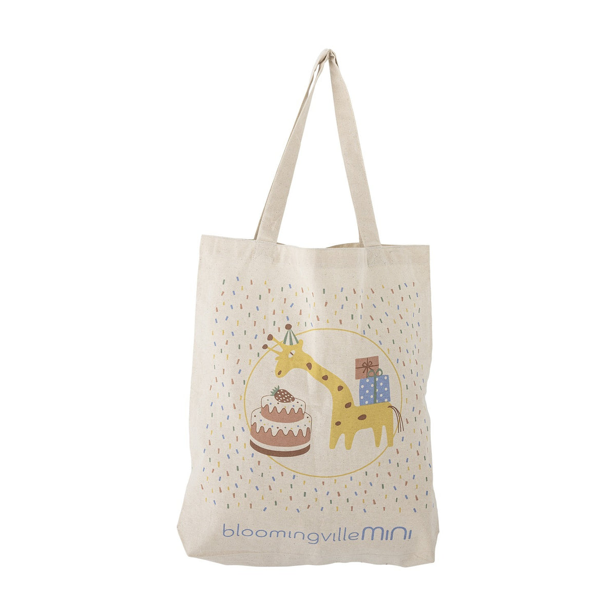 Beige cotton tote bag with long handles, printed with a party giraffe, layered cake, wrapped presents and confetti, shown on a plain white background.