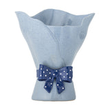 Belivia Bouquet Stoneware Vase 28.5cm in speckled blue with a wavy, petal-like rim, draped folded sides, and a glossy navy polka-dot bow at the base, on a plain white background.